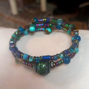 Pretty Czech beaded bracelet with crystals on memory wire in shades of t…